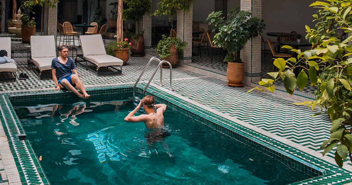 Unmarried couple in a pool in Marrakech, Morocco